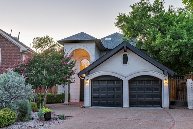 8931 Club Creek Cir, Dallas, TX 75238 - view of front of property with driveway, an attached garage, brick siding, and a shingled roof