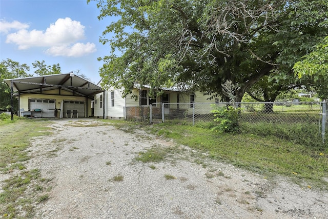 221 E 7th St, Weatherford, TX 76086 - view of front facade with a garage, driveway, and an outdoor structure
