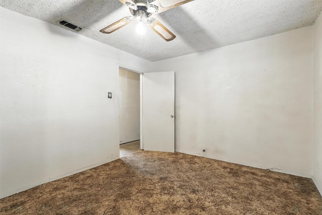 221 E 7th St, Weatherford, TX 76086 - empty room featuring carpet floors, ceiling fan, and a textured ceiling
