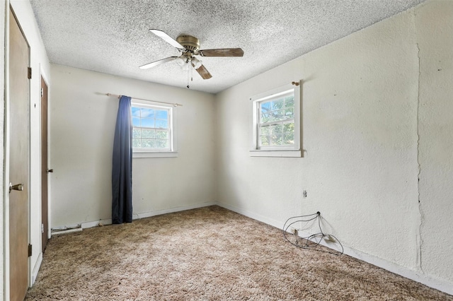 221 E 7th St, Weatherford, TX 76086 - unfurnished bedroom with carpet floors, a textured ceiling, and a ceiling fan