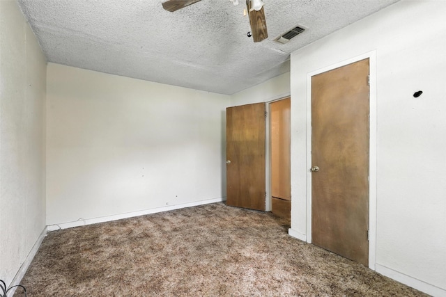 221 E 7th St, Weatherford, TX 76086 - unfurnished bedroom featuring carpet flooring, a textured ceiling, and a ceiling fan