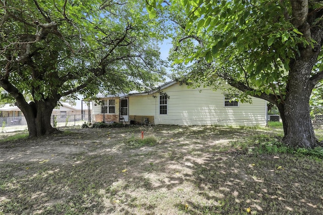 221 E 7th St, Weatherford, TX 76086 - rear view of house featuring brick siding