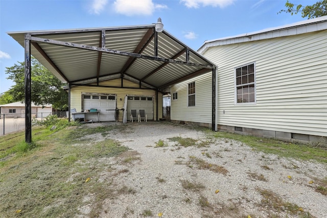 221 E 7th St, Weatherford, TX 76086 - rear view of property with an outdoor structure, driveway, and crawl space