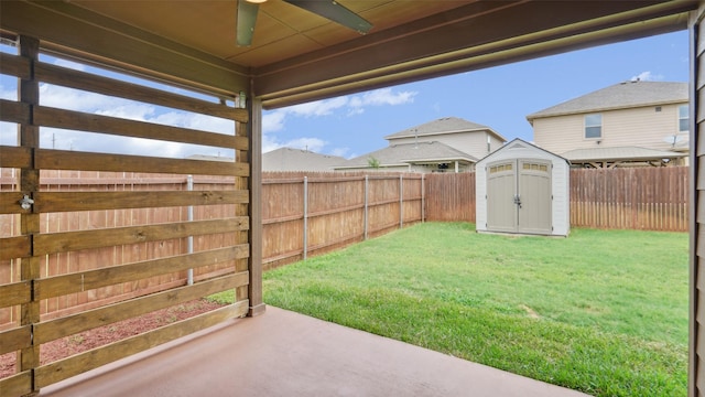 6348 Porthole Ln, Fort Worth, TX 76179 - fenced backyard with a ceiling fan, a storage unit, and a patio area
