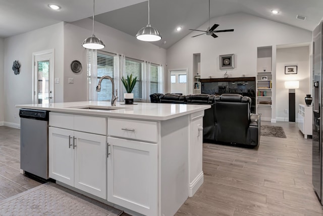 237 Gardenia Dr, Azle, TX 76020 - kitchen featuring light countertops, white cabinetry, light wood-type flooring, ceiling fan, and vaulted ceiling