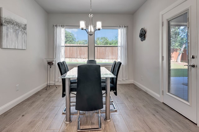 237 Gardenia Dr, Azle, TX 76020 - dining space featuring a chandelier and light wood-style flooring
