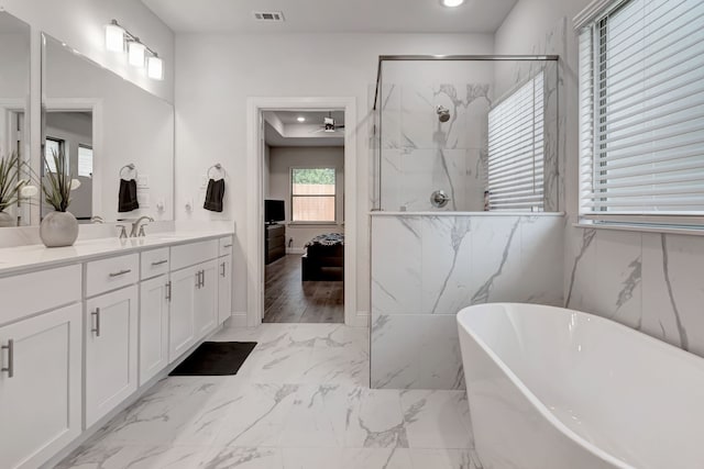 237 Gardenia Dr, Azle, TX 76020 - full bath featuring connected bathroom, a soaking tub, marble finish flooring, vanity, and a marble finish shower