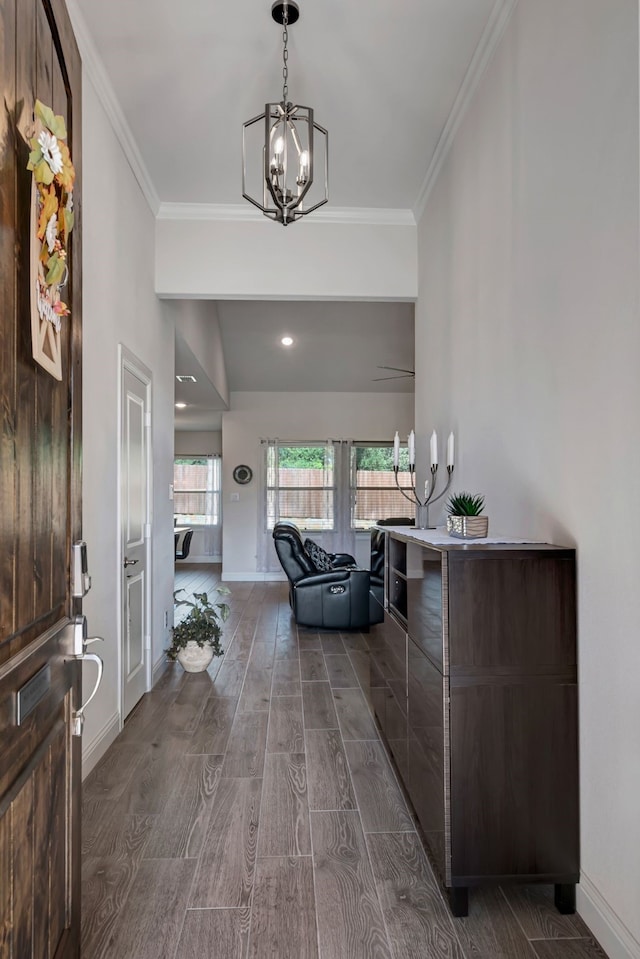 237 Gardenia Dr, Azle, TX 76020 - entryway with a chandelier, dark wood-style flooring, and ornamental molding