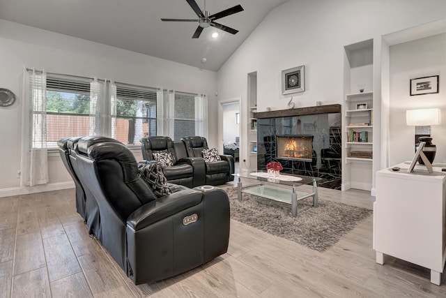 237 Gardenia Dr, Azle, TX 76020 - living area featuring ceiling fan, light wood-style flooring, high vaulted ceiling, and a fireplace