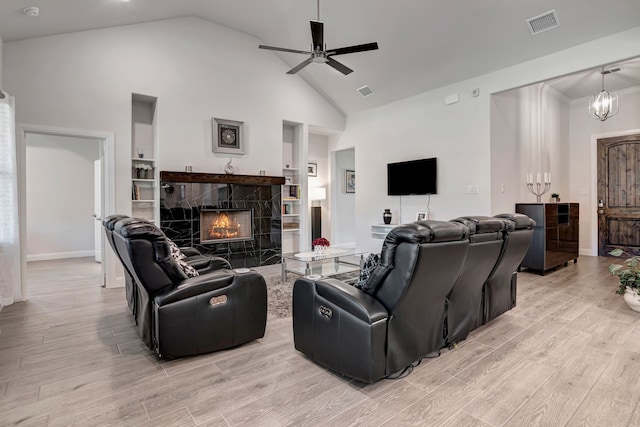 237 Gardenia Dr, Azle, TX 76020 - living room featuring light wood-style flooring, a high end fireplace, ceiling fan, and high vaulted ceiling