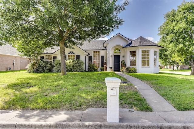 700 Stanford Dr, Waxahachie, TX 75165 - view of front of home with roof with shingles and a front lawn