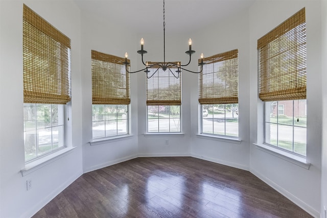 700 Stanford Dr, Waxahachie, TX 75165 - unfurnished dining area with a chandelier and dark wood finished floors