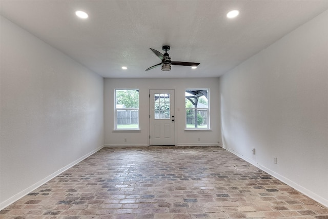 700 Stanford Dr, Waxahachie, TX 75165 - empty room with recessed lighting, ceiling fan, and brick flooring
