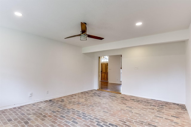 700 Stanford Dr, Waxahachie, TX 75165 - unfurnished room featuring brick floors, a ceiling fan, and recessed lighting