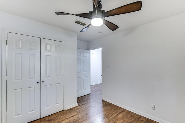 700 Stanford Dr, Waxahachie, TX 75165 - unfurnished bedroom featuring wood finished floors, a closet, and a ceiling fan