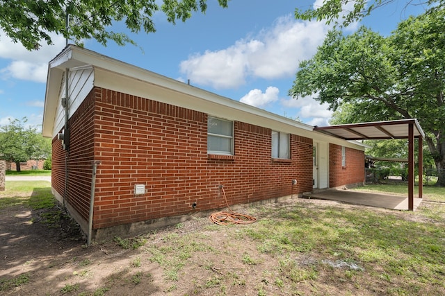721 SW Hillside Dr, Burleson, TX 76028 - view of property exterior with brick siding and a patio area