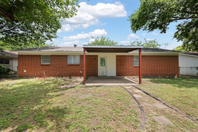 721 SW Hillside Dr, Burleson, TX 76028 - back of property with a patio area and brick siding