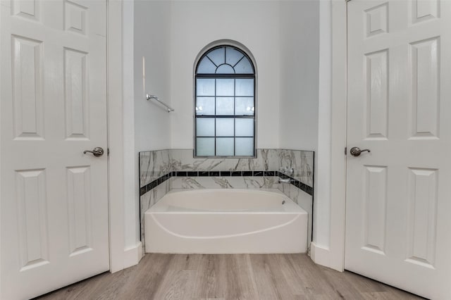 4030 Walnut Ln, Midlothian, TX 76065 - bathroom with a bath and wood finished floors