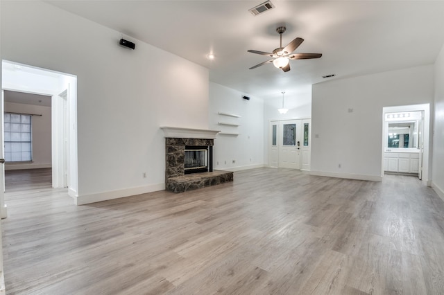 4030 Walnut Ln, Midlothian, TX 76065 - unfurnished living room with ceiling fan, a fireplace, and light wood-style flooring