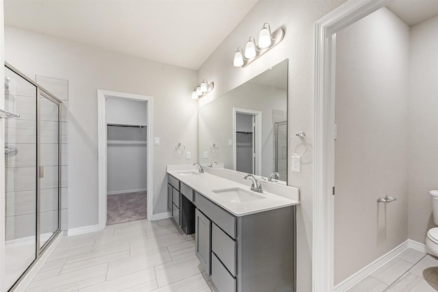 1327 Burgess St, Royse City, TX 75189 - bathroom featuring a spacious closet, double vanity, and a stall shower