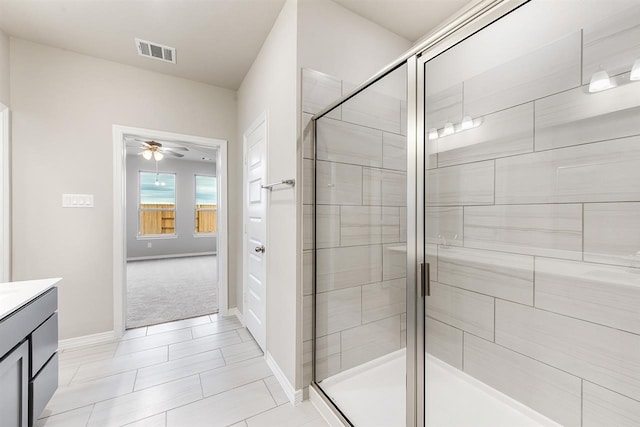 1327 Burgess St, Royse City, TX 75189 - bathroom with vanity, a stall shower, ceiling fan, and tile patterned floors