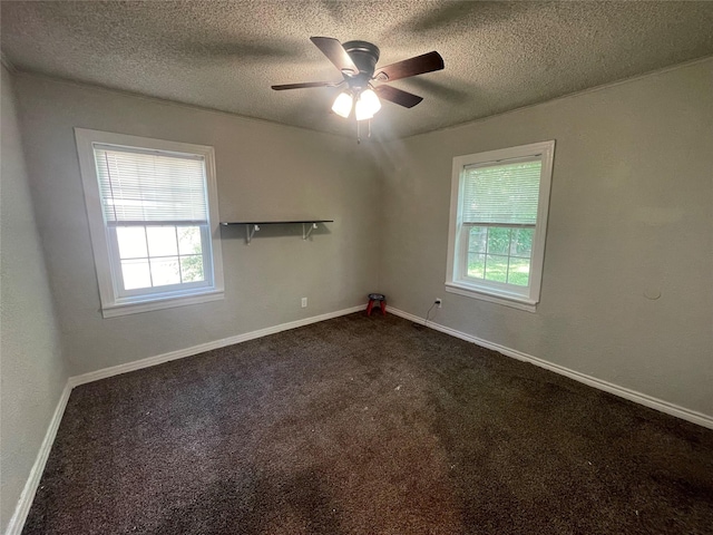 207 Whitworth St, Sulphur Springs, TX 75482 - unfurnished room with healthy amount of natural light, dark carpet, a textured ceiling, and ceiling fan
