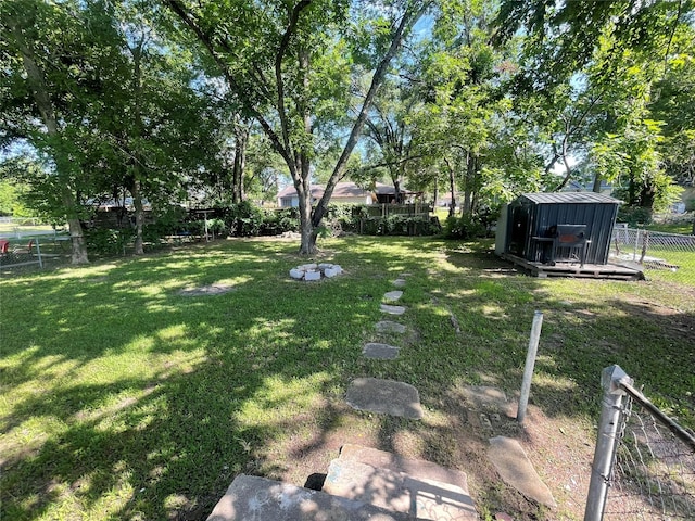 207 Whitworth St, Sulphur Springs, TX 75482 - fenced backyard featuring a storage shed