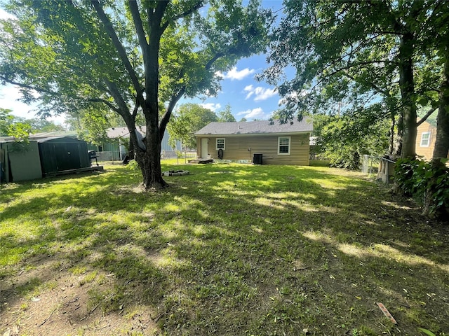 207 Whitworth St, Sulphur Springs, TX 75482 - fenced backyard with a storage unit