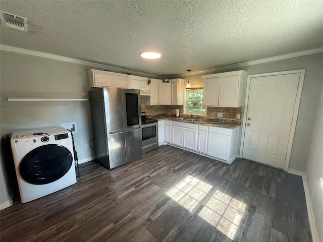 207 Whitworth St, Sulphur Springs, TX 75482 - kitchen with washer / clothes dryer, appliances with stainless steel finishes, dark wood-style flooring, crown molding, and white cabinetry