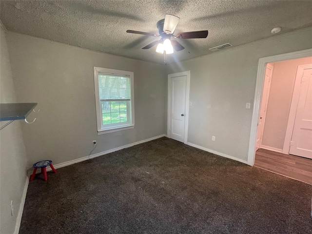 207 Whitworth St, Sulphur Springs, TX 75482 - unfurnished bedroom with carpet floors, a textured ceiling, and a ceiling fan