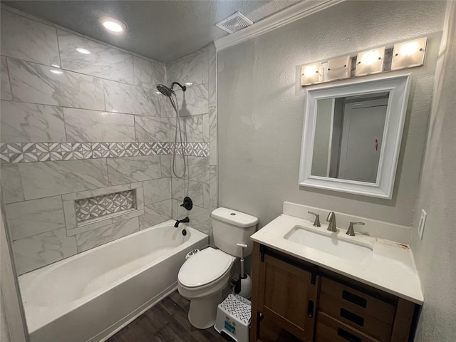 207 Whitworth St, Sulphur Springs, TX 75482 - bathroom featuring vanity, wood finished floors, shower / tub combination, and a textured wall
