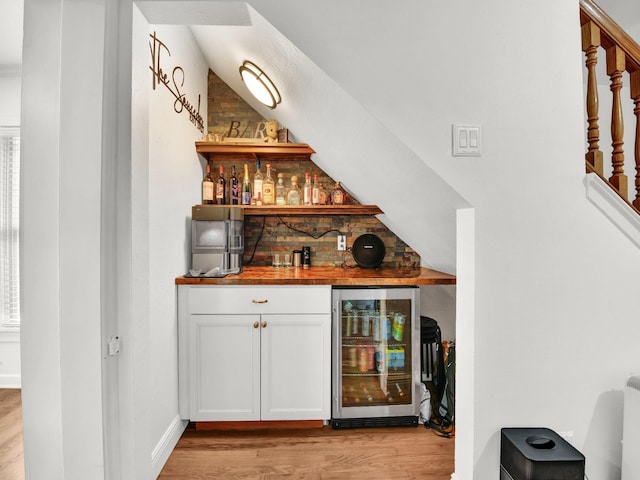 3921 Bryce Ave, Fort Worth, TX 76107 - indoor dry bar featuring beverage cooler and light wood finished floors