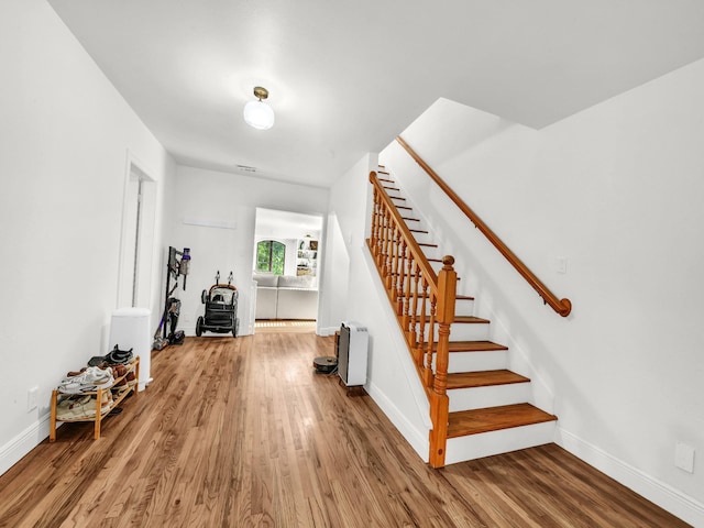 3921 Bryce Ave, Fort Worth, TX 76107 - stairs featuring wood finished floors and baseboards