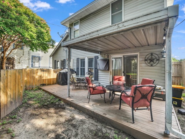 3921 Bryce Ave, Fort Worth, TX 76107 - deck featuring grilling area and outdoor dining space