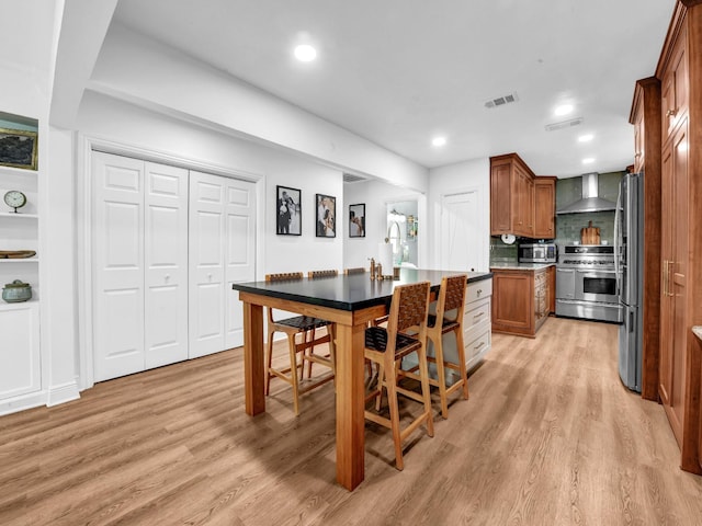 3921 Bryce Ave, Fort Worth, TX 76107 - dining room with light wood finished floors and recessed lighting