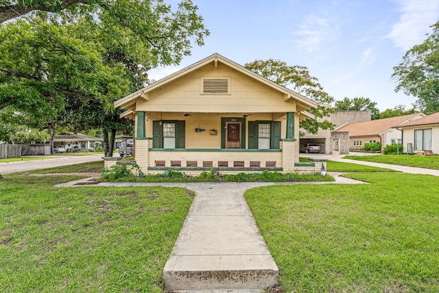 814 N Ollie St, Stephenville, TX 76401 - view of front of home featuring covered porch, a front yard, and ceiling fan