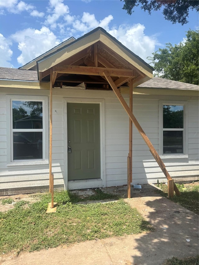 8708 Ronnie, White Settlement, TX 76108 - entrance to property featuring a shingled roof