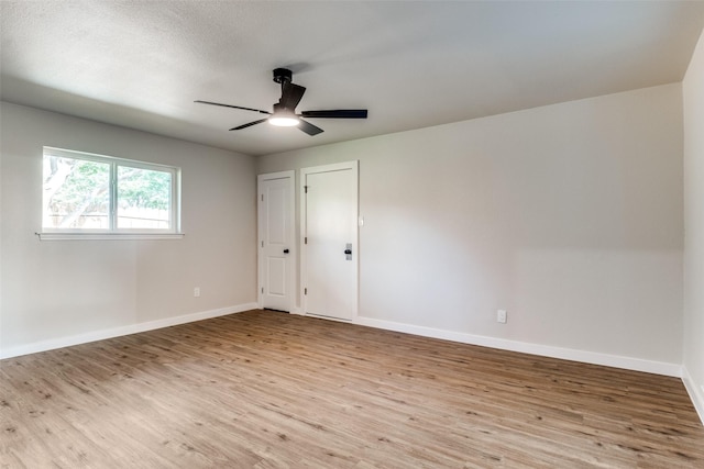 707 Lake Meadows Dr, Rockwall, TX 75087 - empty room with wood finished floors and a ceiling fan