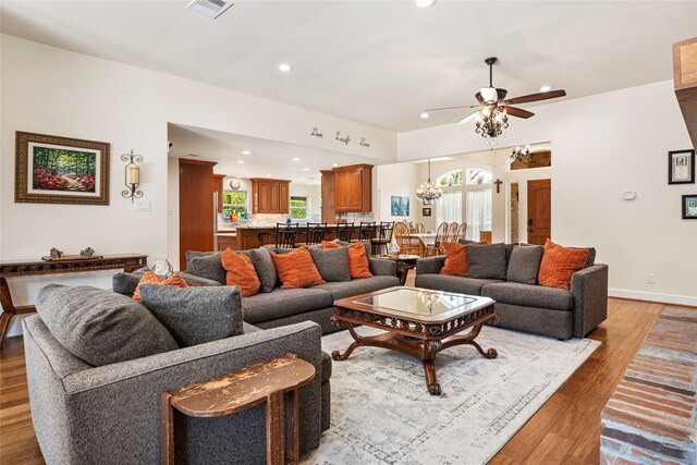 750 Emerald Sound Blvd, Oak Point, TX 75068 - living area with a ceiling fan, light wood finished floors, recessed lighting, and a chandelier