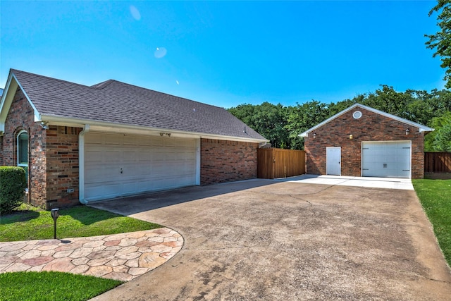 750 Emerald Sound Blvd, Oak Point, TX 75068 - view of home's exterior featuring brick siding, roof with shingles, and driveway