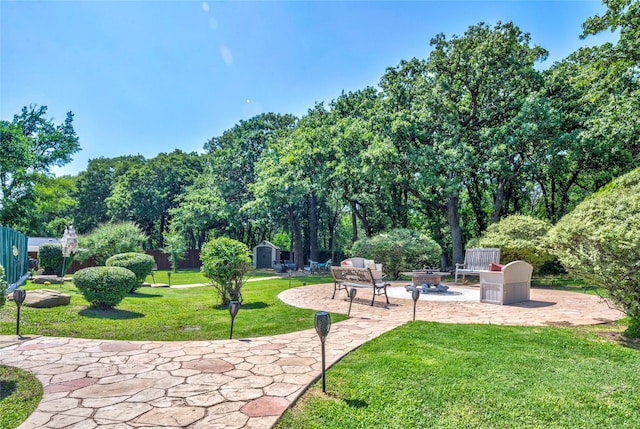 750 Emerald Sound Blvd, Oak Point, TX 75068 - view of community featuring a patio, a shed, a fire pit, and view of wooded area
