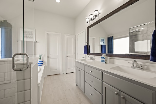 1105 Denton Creek Dr, Justin, TX 76247 - full bath featuring a stall shower, double vanity, a garden tub, lofted ceiling, and tile patterned flooring