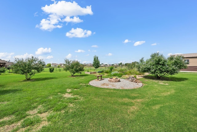 1105 Denton Creek Dr, Justin, TX 76247 - view of grassy yard with a fire pit