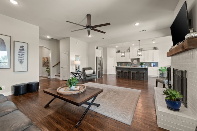 1105 Denton Creek Dr, Justin, TX 76247 - living area featuring ceiling fan, stairs, dark wood finished floors, and recessed lighting