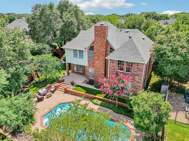 6903 Glenview Ln, Colleyville, TX 76034 - rear view of property featuring a patio, a chimney, brick siding, a pool, and a shingled roof