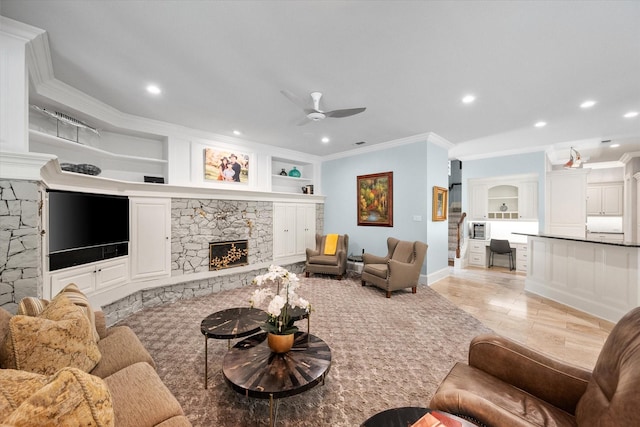 5106 Oak Ln, Arlington, TX 76017 - living area featuring ornamental molding, a ceiling fan, a stone fireplace, built in features, and recessed lighting