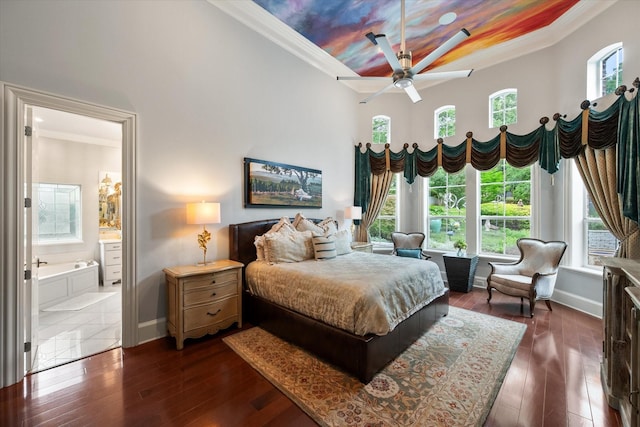 5106 Oak Ln, Arlington, TX 76017 - bedroom with crown molding, dark wood-style flooring, and connected bathroom