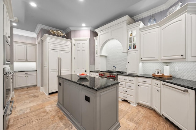 5106 Oak Ln, Arlington, TX 76017 - kitchen featuring crown molding, high quality appliances, backsplash, white cabinets, and recessed lighting