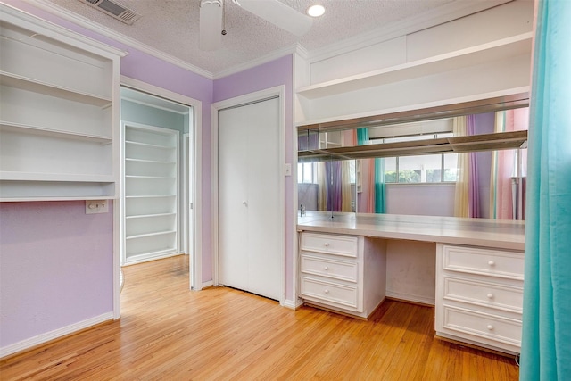 108 Smallwood Dr, Westworth Village, TX 76114 - unfurnished office with built in desk, light wood finished floors, ornamental molding, ceiling fan, and a textured ceiling