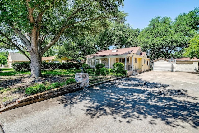 108 Smallwood Dr, Westworth Village, TX 76114 - view of front facade with an outdoor structure, driveway, and a porch